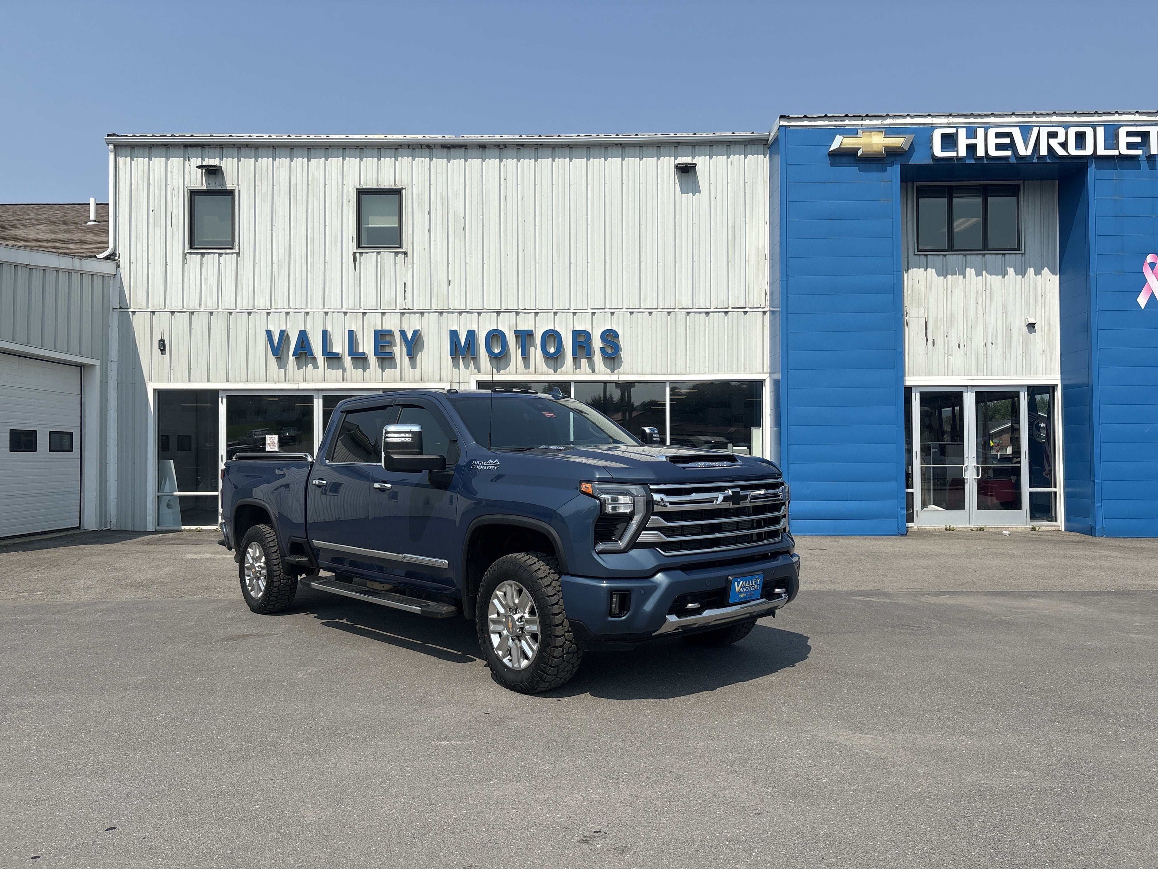 2025 Chevrolet Silverado 2500 HD High Country in Lakeshore Blue Metallic — front three-quarter view